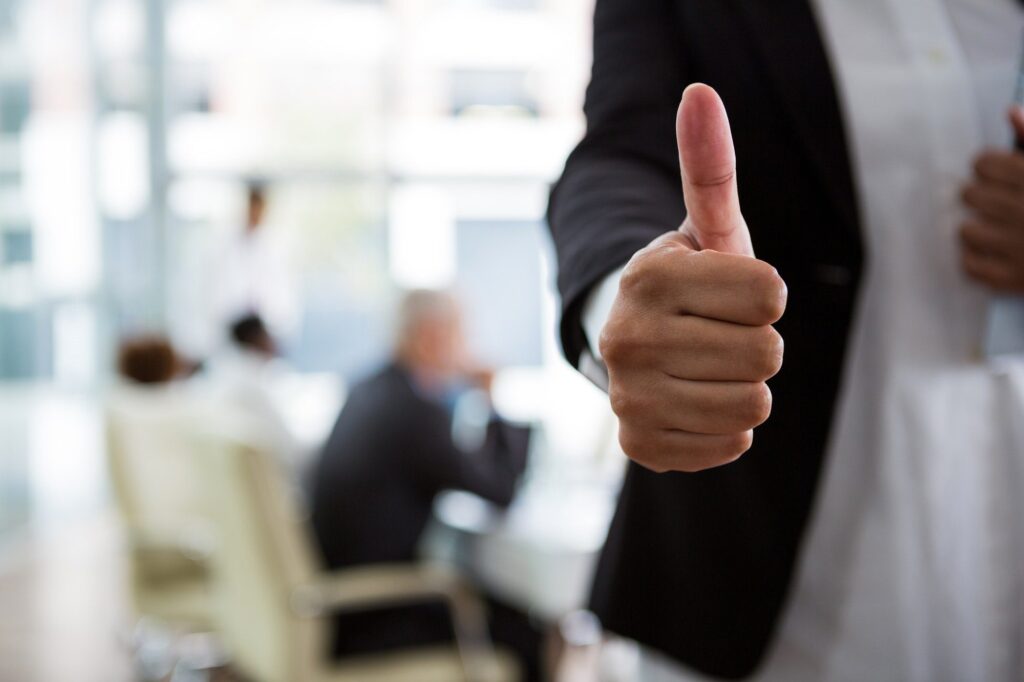 Businesswoman showing thumbs up